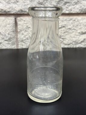 Antique DeLaval embossed glass dairy bottle